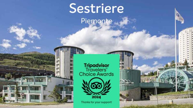 Obraz Sestriere, Piemonte, z nowoczesnymi budynkami i logo nagród Travelers' Choice od Tripadvisor 2024.