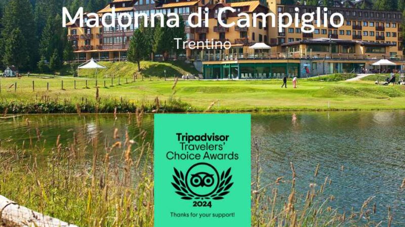 Widok na Madonna di Campiglio z budynkiem, jeziorem i górami w tle. Wyróżnienie Tripadvisor 2024.